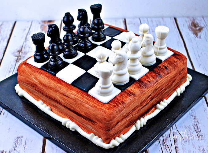 A cake in the form of Chessboard with King and Queen on top of it – Creme  Castle